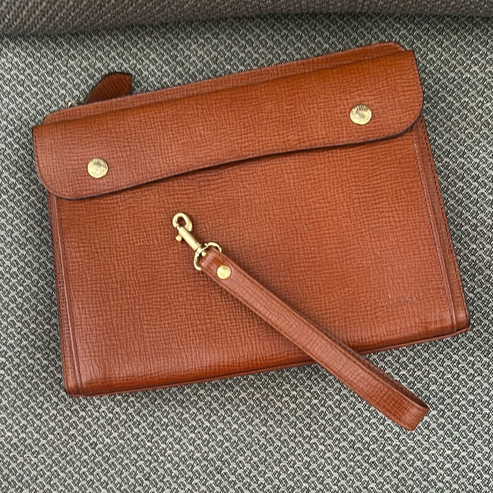 Burberry’s vintage brown leather clutch or second bag with wrist strap. Unisex.